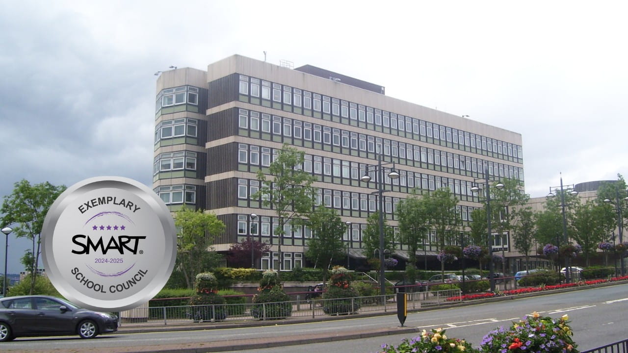 North Lanarkshire building with SMART Exemplary School Council badge for 2024–2025.