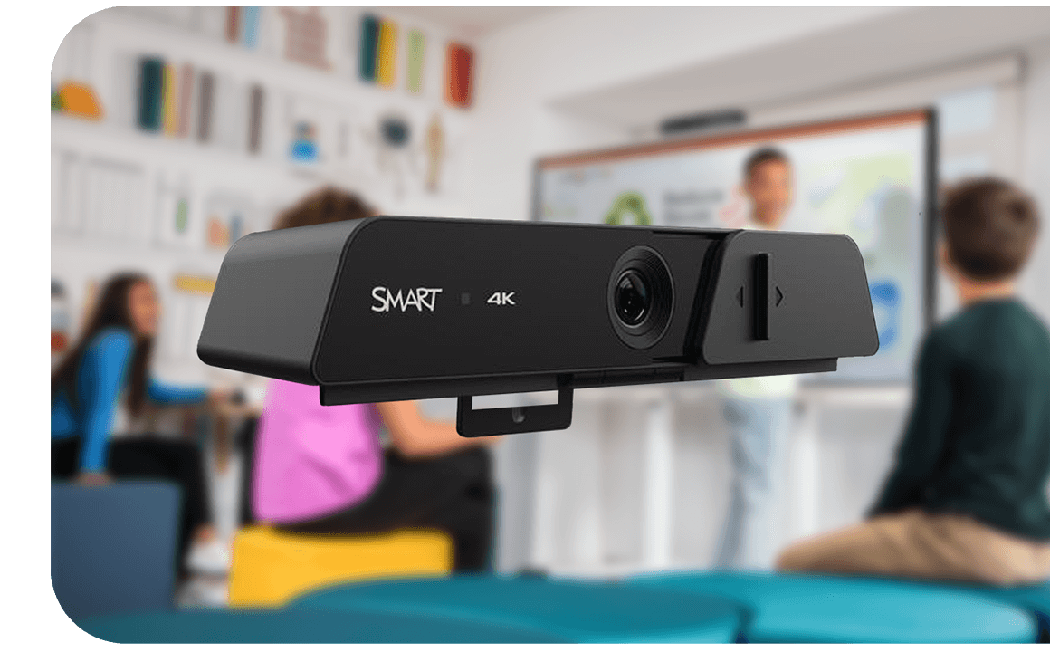 Close-up of SMART 4K webcam with blurred background of teacher and students in a classroom setting.